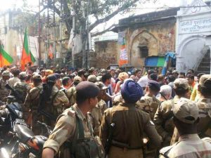 lawsuit against bjp leader was distributing sweets in Procession